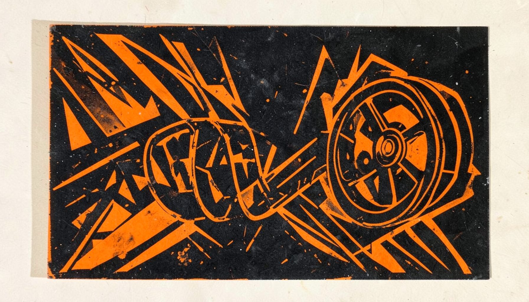 A carved linocut relief print of a dramatic film reel unspooling across a dark background, with bold angular shapes in deep orange and charcoal black, evoking the energy of Tamil cinema